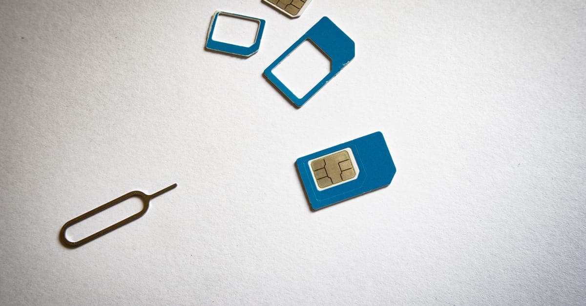 Close-up of SIM cards and ejector tool illustrating what a Tesco pay as you go SIM looks like