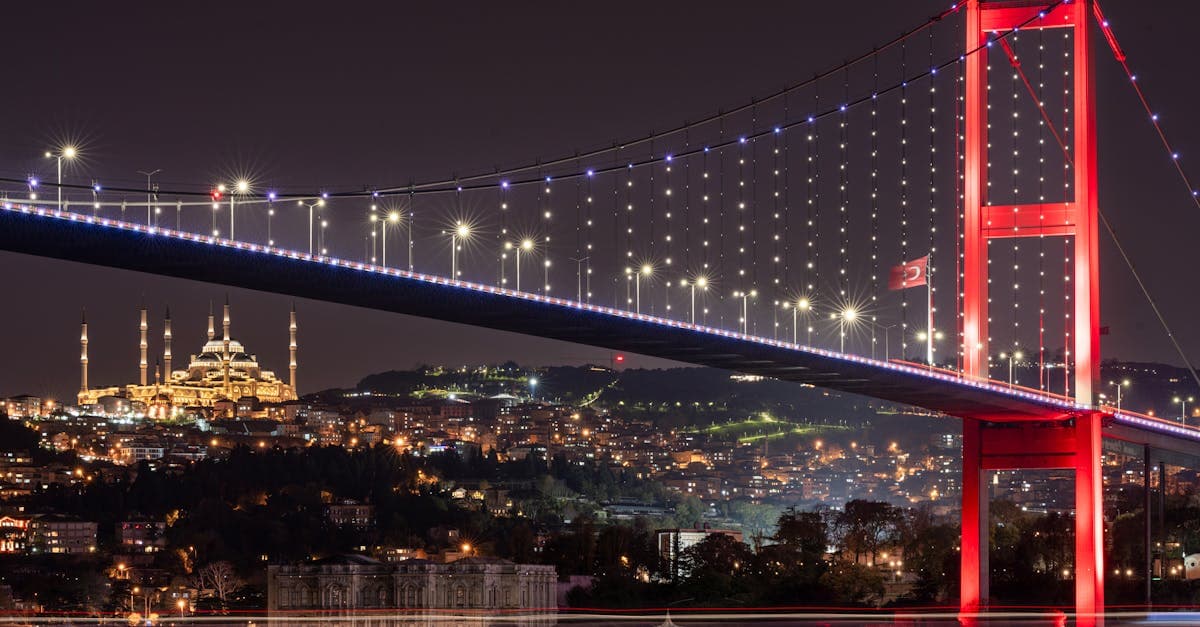 Bosphorus Bridge illuminated against the Istanbul night skyline, symbolising seamless connectivity with the best esim turkey option.