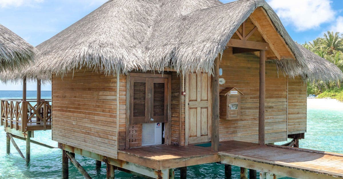 Iconic overwater bungalow for the best time to visit Maldives, nestled on a tropical island