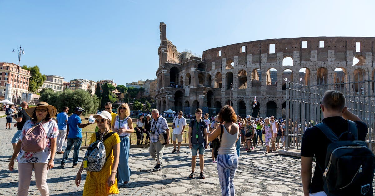 Tourists gathered outside the Colosseum in Rome, capturing the vibrant sightseeing start of a food tour rome