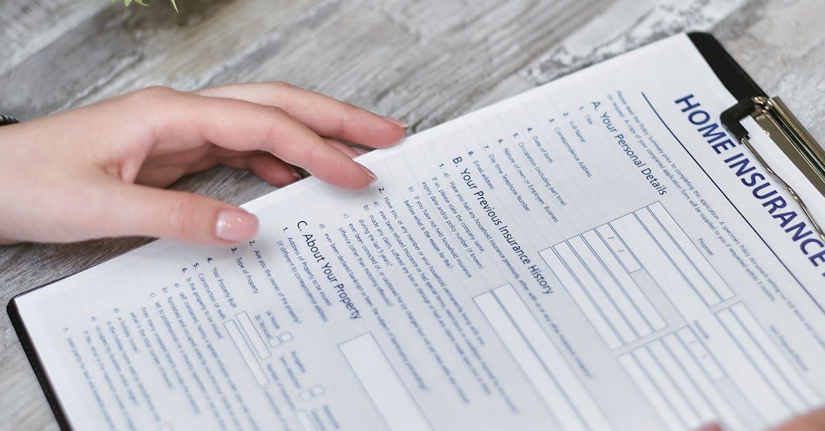 Close-up of hands holding a medical insurance document, relevant to kidney stone cover under US travel insurance.