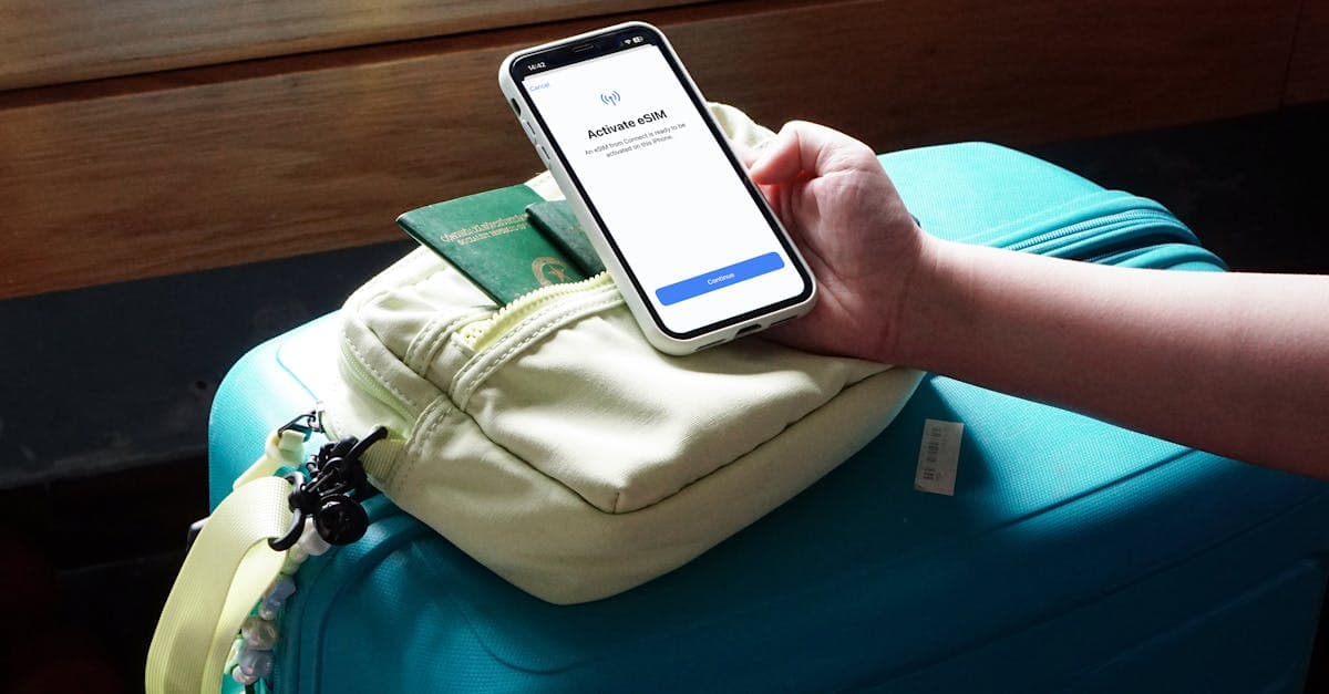 Traveller activating an esim turkey on a smartphone beside packed luggage, ready to connect on arrival.