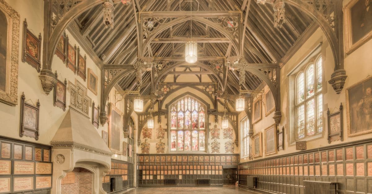 International Hall's grand interior at the University of London, showcasing ornate timber and stained glass windows