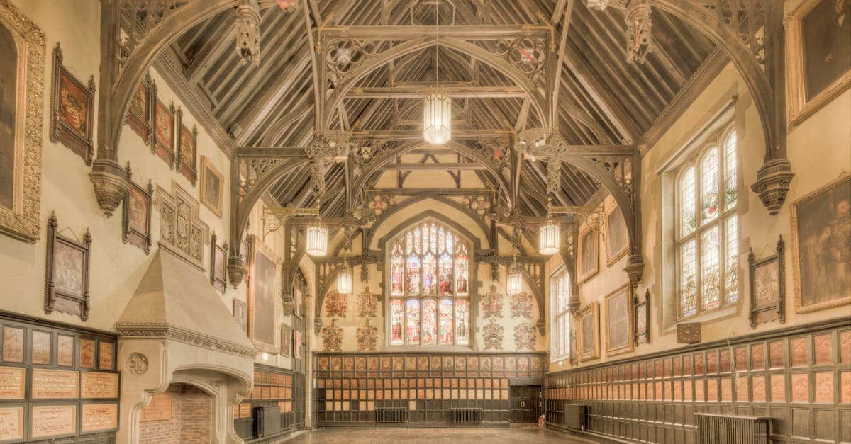 Historic International Hall building showcasing ornate timber architecture and vibrant stained glass windows.