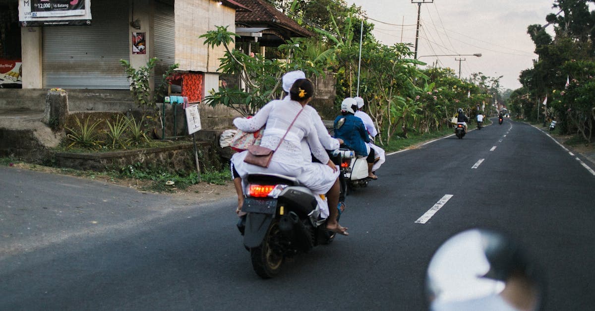 Motorcyclists cruising through a lush tropical Bali village road — the essential safety checklist for NZ travellers
