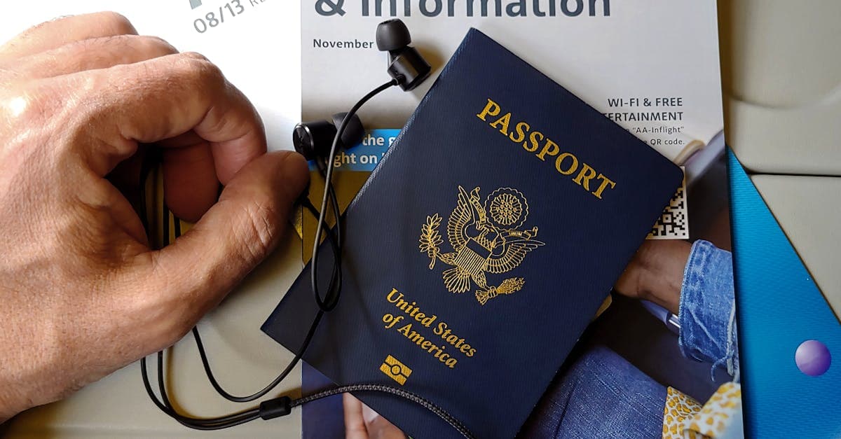 US passport beside inflight magazine and headphones, travel essentials after securing a us visa appointment