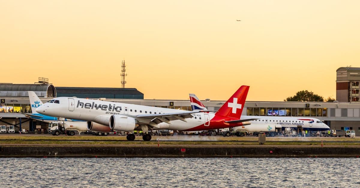 Airplane on the runway at London City Airport representing airlines operating sydney to london flights.