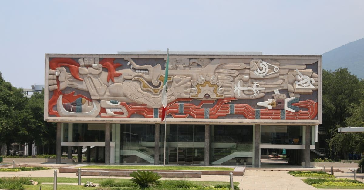 University building facade with vibrant mural artwork, a cultural landmark in Monterrey Mexico