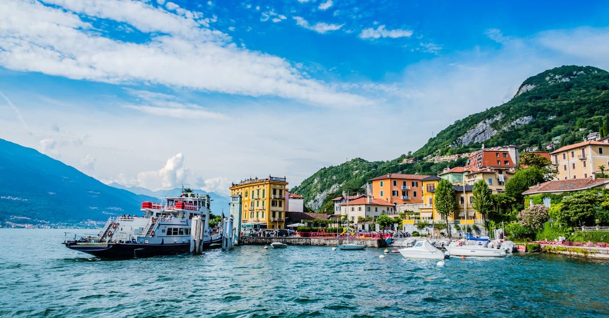 Colorful waterfront buildings and boats along Lake Como in Lombardy, Italy, a stunning December destination in Europe