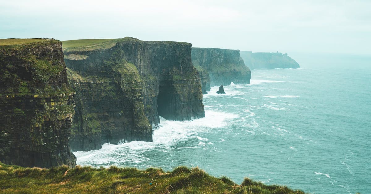 Cliffs of Moher under an overcast sky showing Ireland's dramatic coastal weather across the seasons