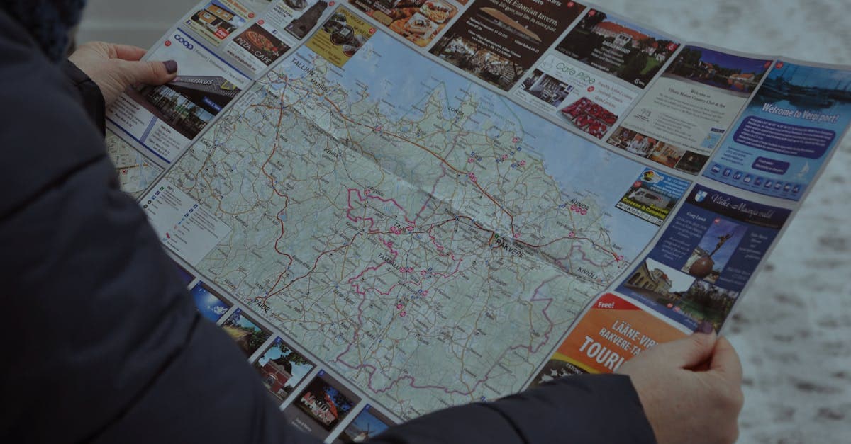 Traveler examining a map outdoors in winter while comparing Europe eSIM providers for the best 2026 plan.