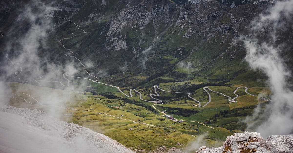 Aerial view of misty mountain roads and lush greenery at a hidden European destination to visit in December