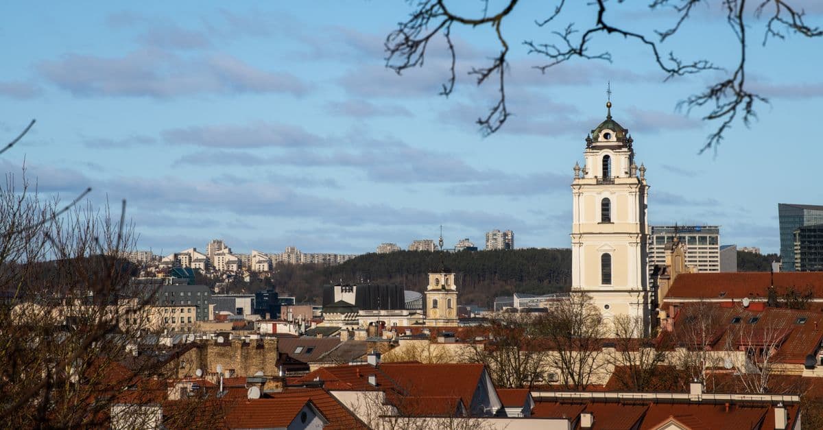 Vilnius old town skyline with a church tower, marking Lithuania's capital location in Europe.