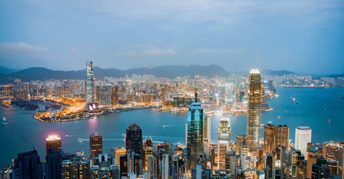 Hong Kong's iconic skyline at dusk over Victoria Harbor, one of Asia's most celebrated central business districts