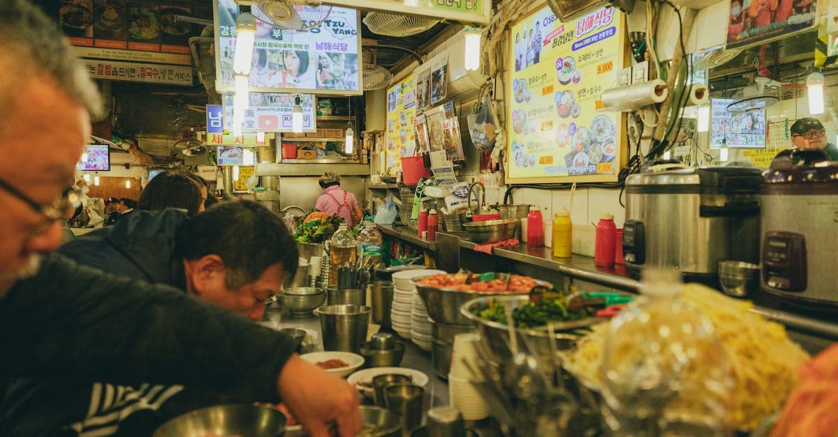 Korean restaurant stall in Seoul's market displaying traditional dishes and fresh ingredients for diverse dietary needs.